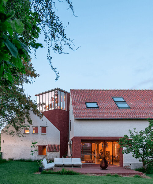objekt architecten exposes red brickwork on renovated farmhouse's facade in belgium