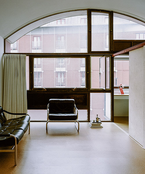 vaulted, 1960s-era 'crescent house' apartment sees retrofit by english studio TYPE
