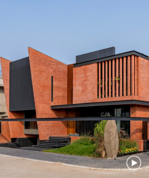red brick and black basalt wrap abhishek ajmera's house in india with tactility